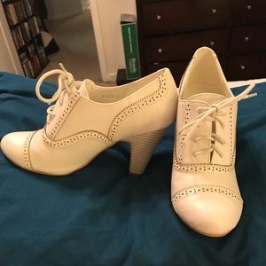 White Mary Jane heels.